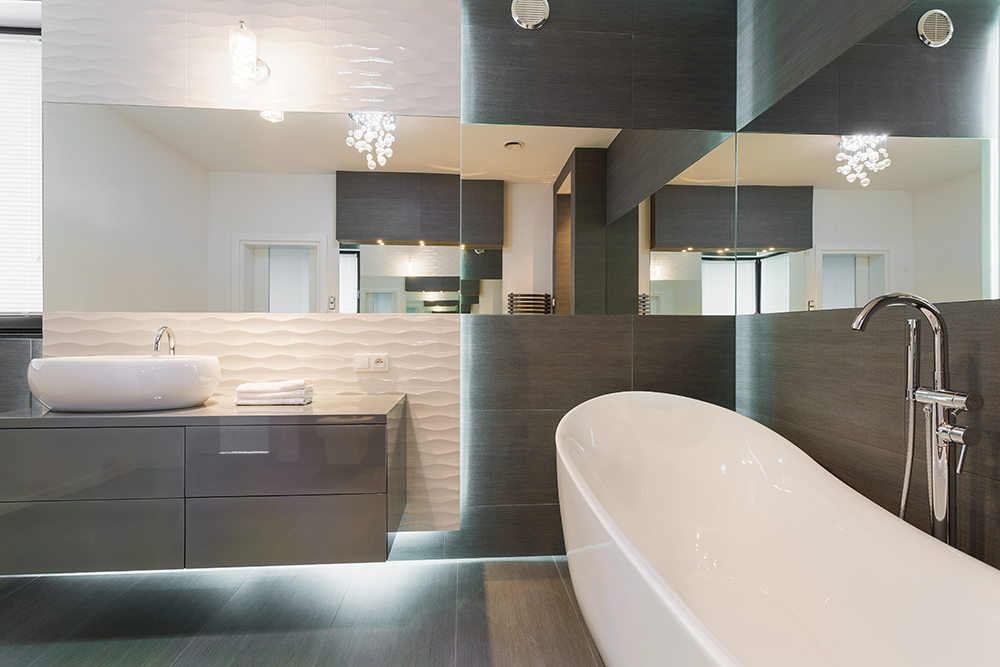 White bathroom with a walk-in glass shower and dark timber vanity